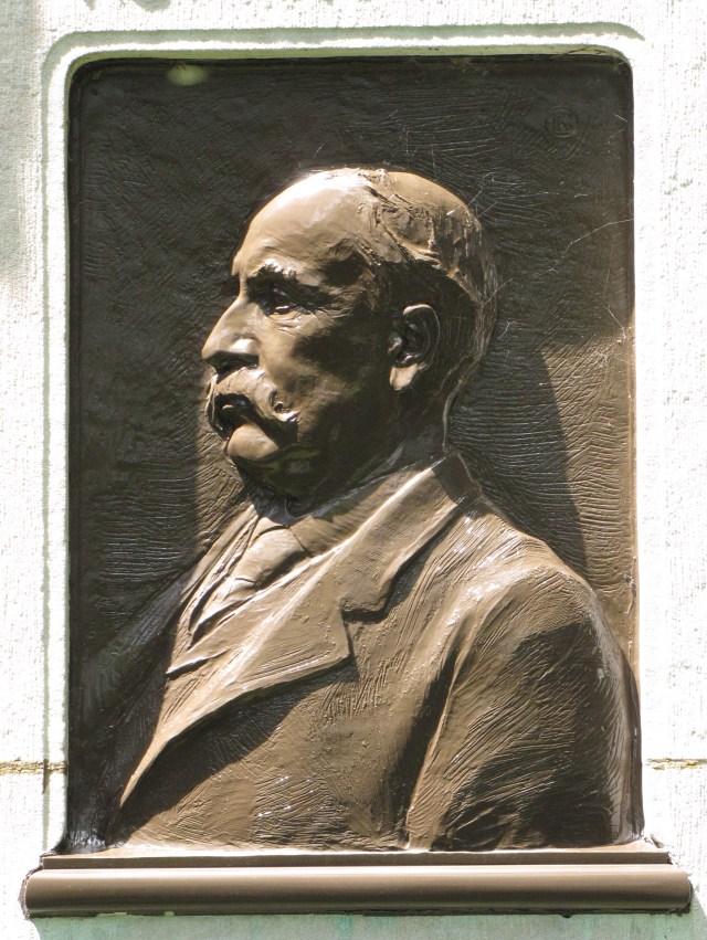 The bs-relief bronze of Henry Villard found on the back of his monument